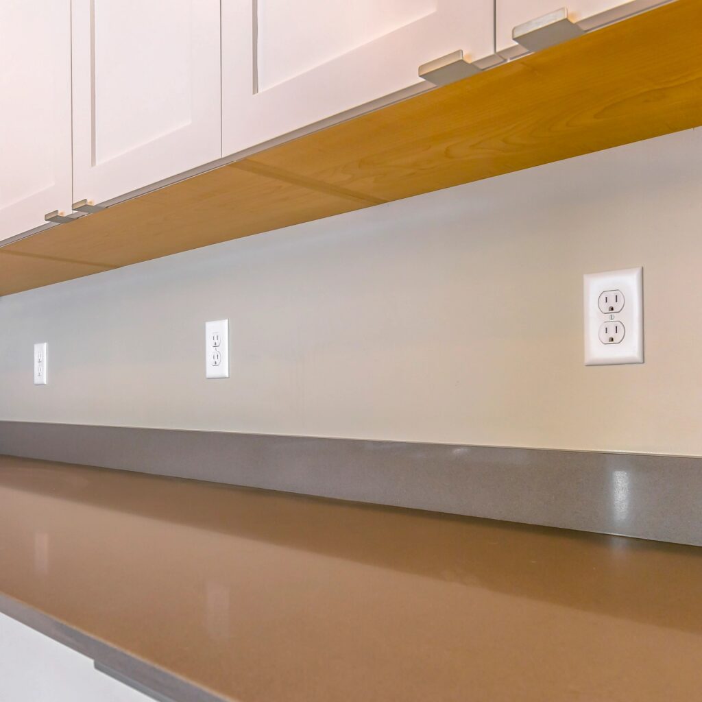 Square frame Gleaming brown countertop inside the kitchen of a new house