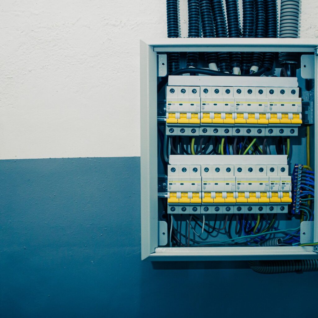 Switchboard equipment. Shield for enterprise electrification. Switchboard for control over electrical equipment. Labeled panel with wires and switches at the enterprise