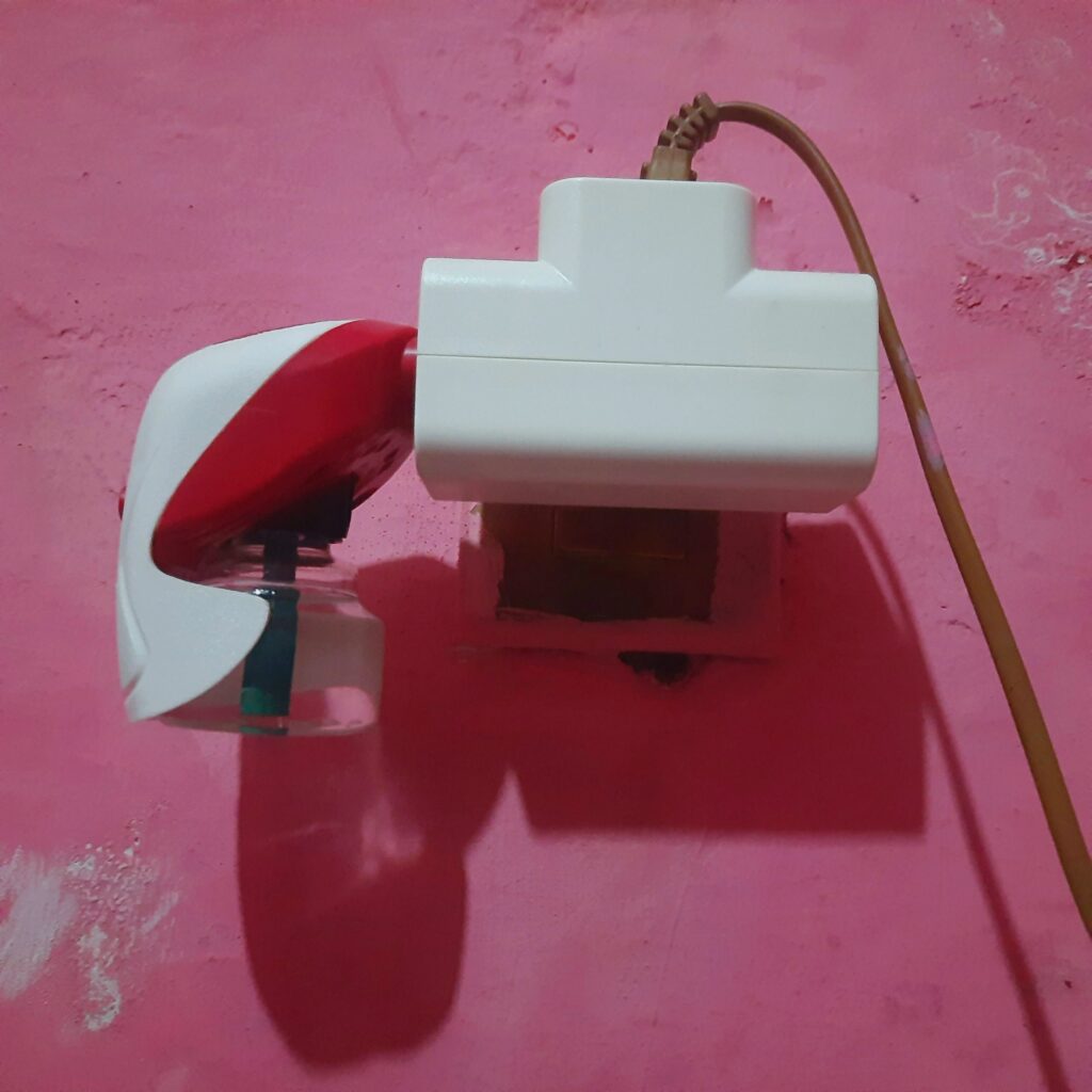 an electric mosquito repellent attached to the power outlet
