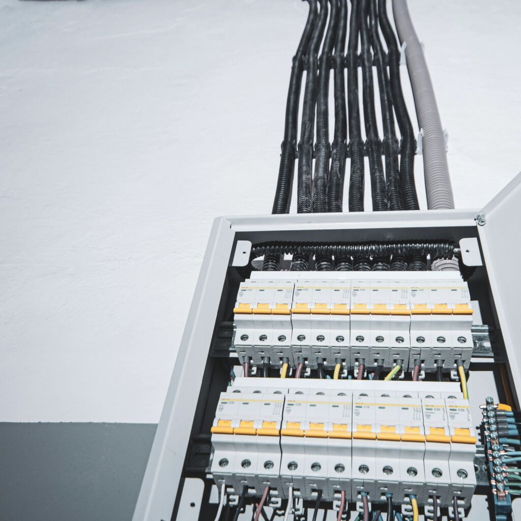 Switchboard equipment. Shield for enterprise electrification. Switchboard for control over electrical equipment. Labeled panel with wires and switches at the enterprise