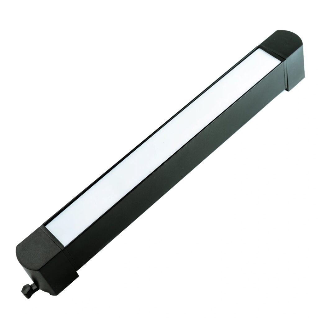 Modern black ceiling LED spotlight in diagonal position, isolated on white background, ideal for lighting design, catalog presentation and interior use.