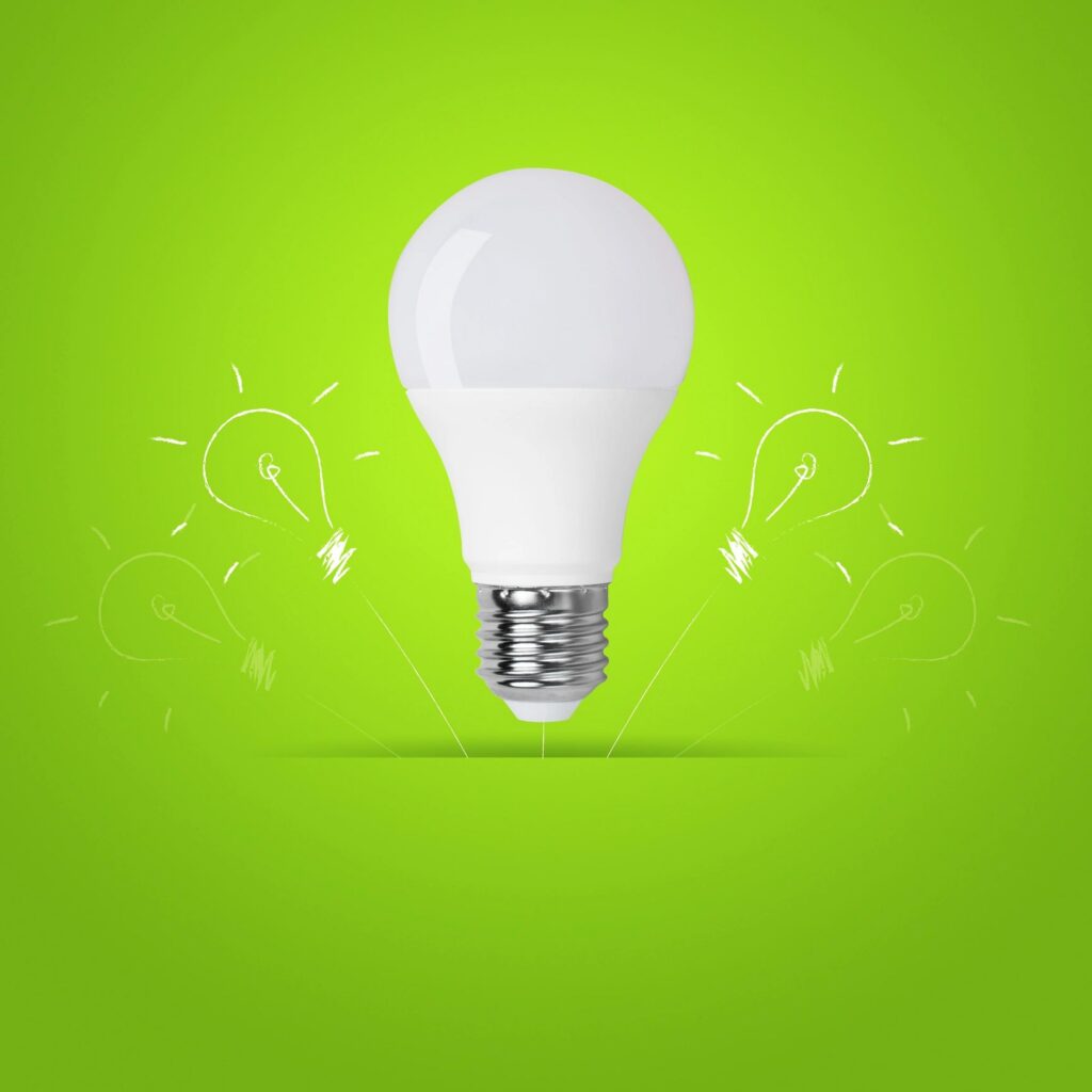 led bulb on green background